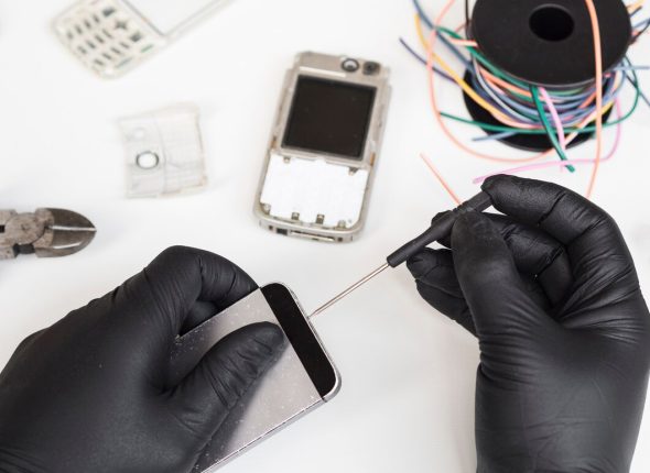 man-using-screwdriver-open-phone_23-2148254148